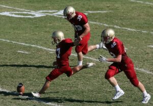 Football player doing a goal kick